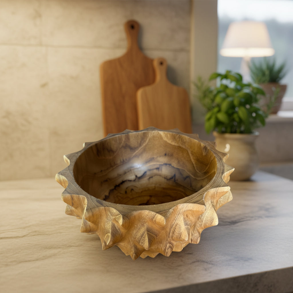 Wooden bowl with unique carvings on a wooden surface