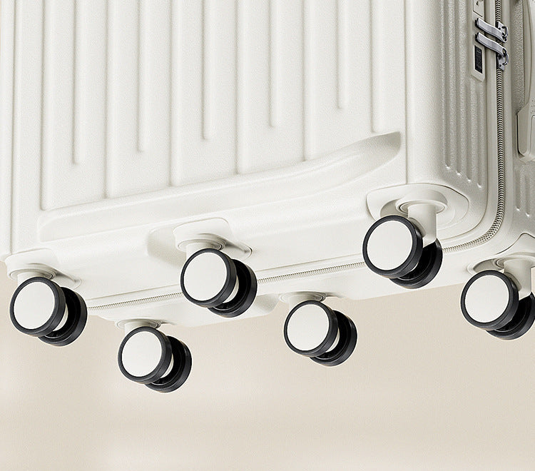 Close-up of the lower section of a white hard-shell suitcase showing six spinner wheels, with Chinese promotional text below.
